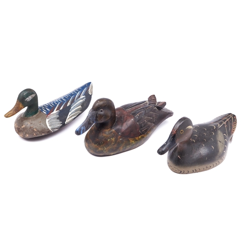 Appraisal: Three painted wood duck decoys cm and c More Information