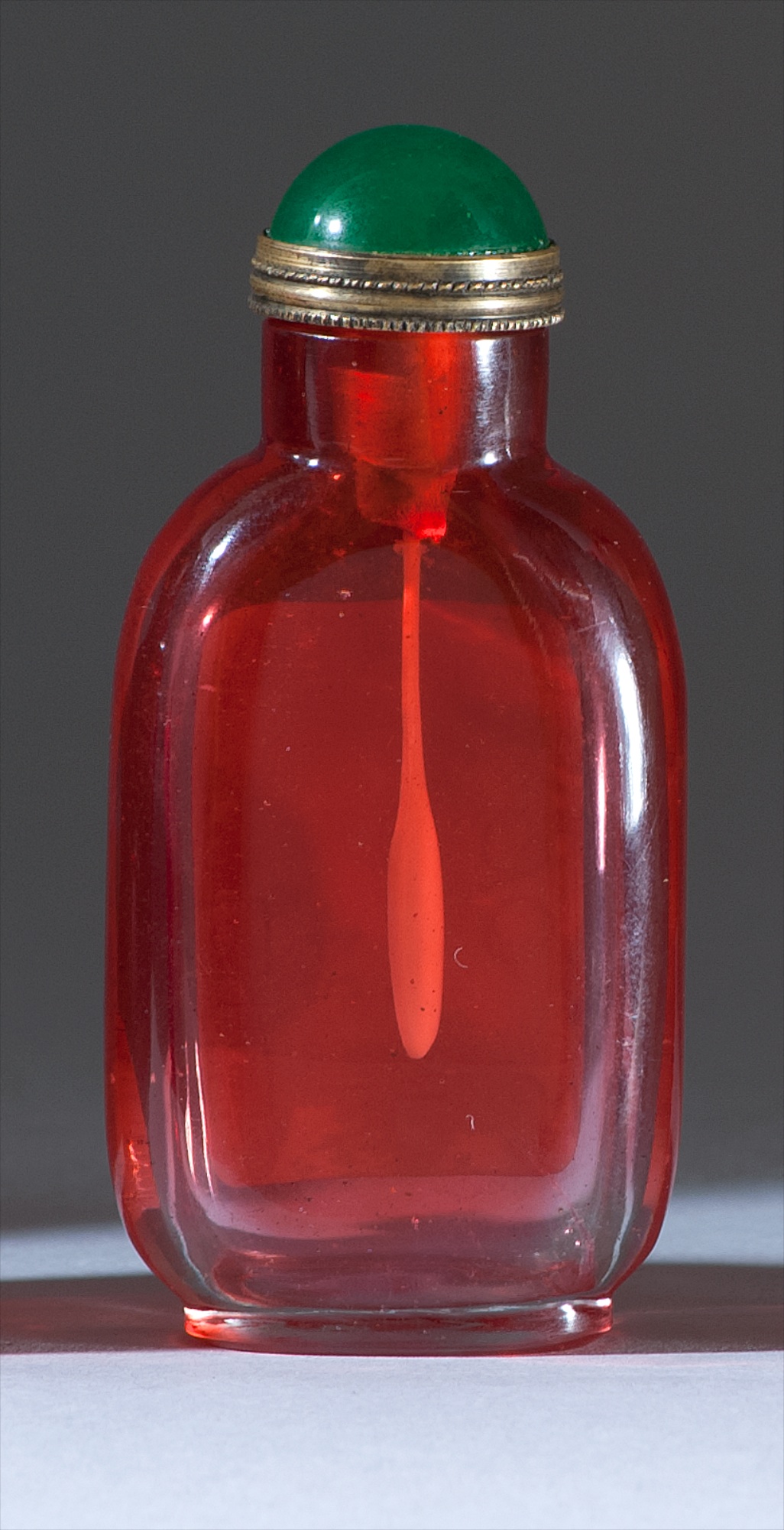 Appraisal: RUBY GLASS SNUFF BOTTLE th CenturyIn modified rectangular form Height