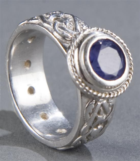 Appraisal: Danoja platinum Celtic band with tanzanite and diamonds Ring has