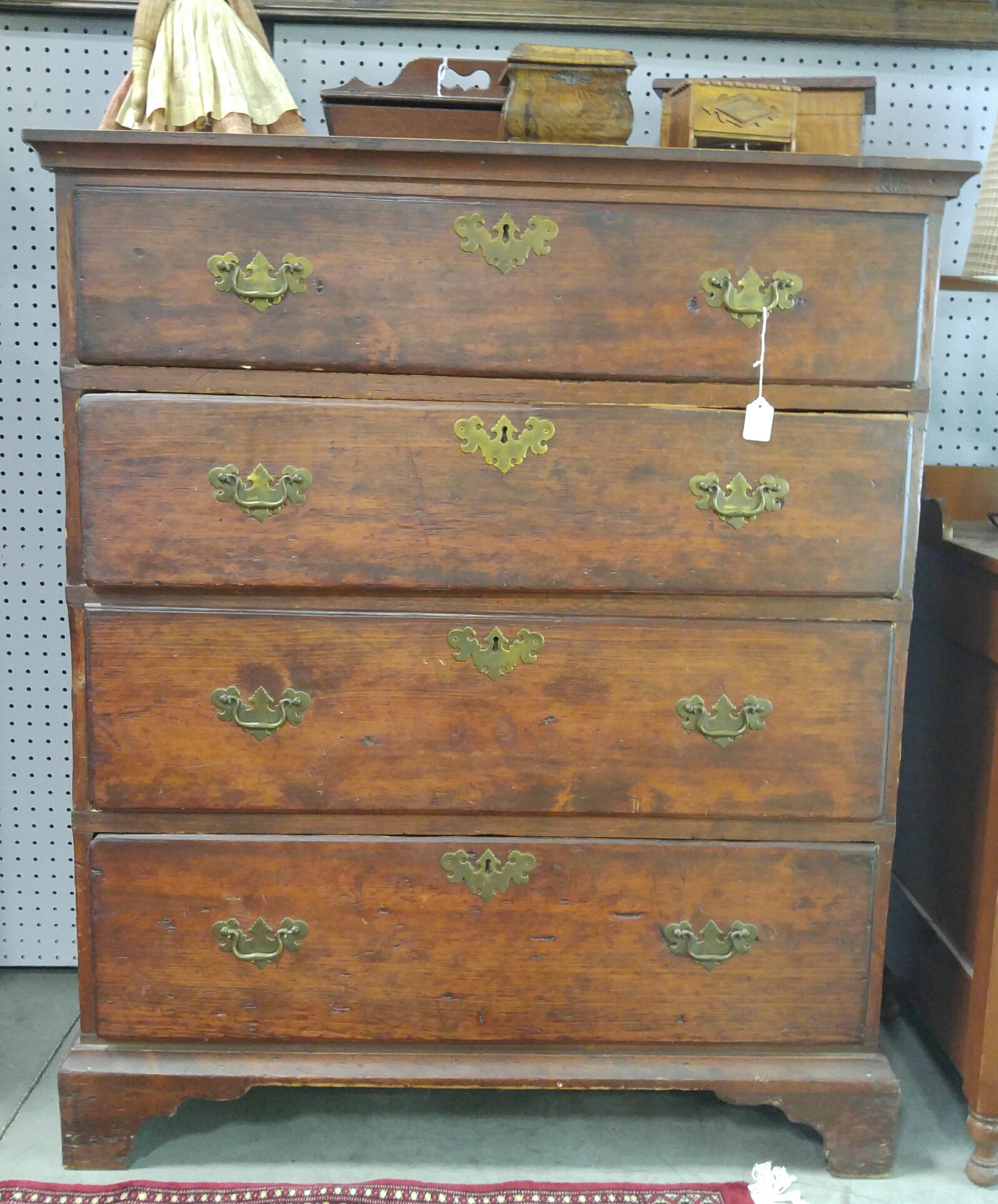 Appraisal: COUNTRY CHIPPENDALE FOUR-DRAWER CHEST American ca pine Dovetailed case picture