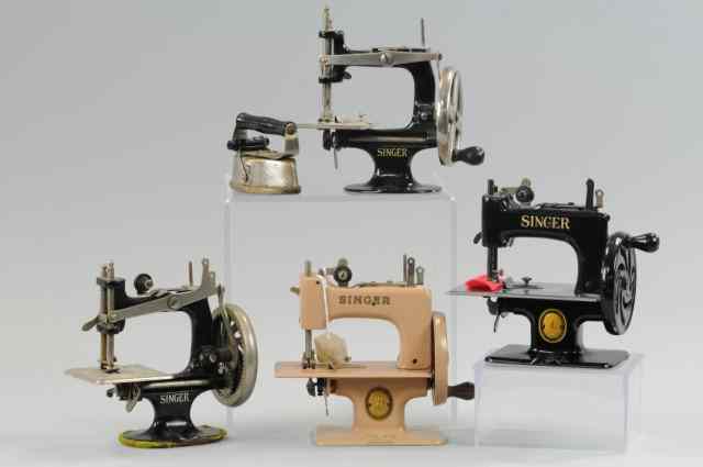 Appraisal: GROUPING OF TOY SINGER SEWING MACHINES Tin and cast iron