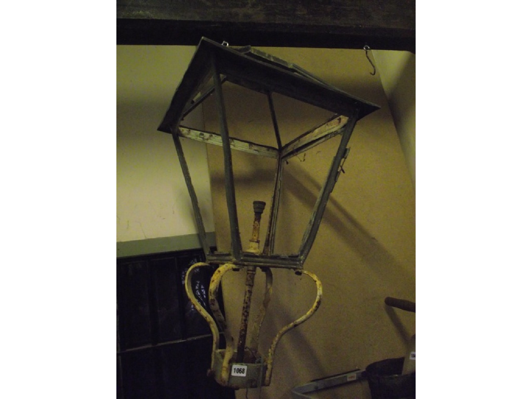 Appraisal: A reclaimed street post lantern hood frame of square tapered