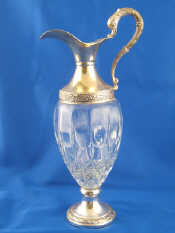 Appraisal: A silver plate mounted glass claret jug ht cm est