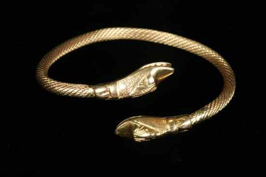 Appraisal: EGYPTIAN K YELLOW GOLD SERPENT BRACELET Twisted rope design terminating