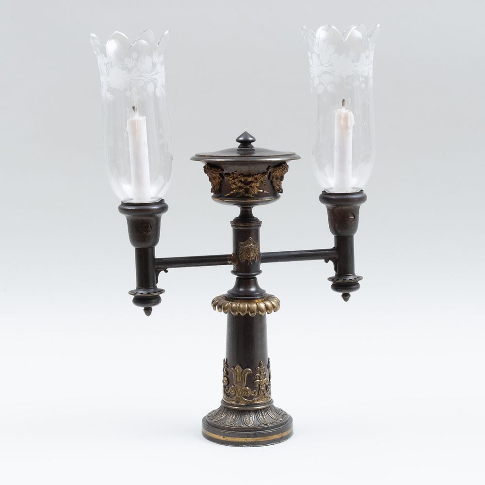 Appraisal: English Bronze Patinated and Gilt-Brass Two-Light Argand Lamp Electrified x