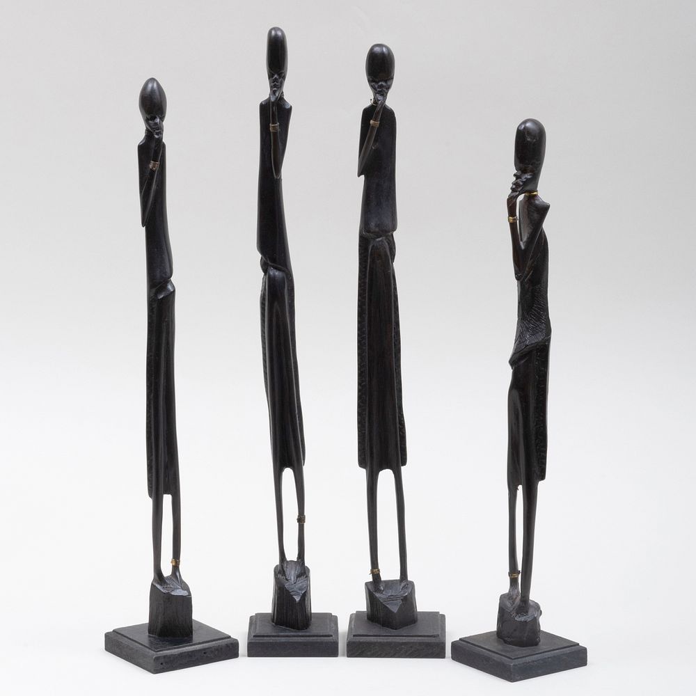 Appraisal: Four Makonde Wood and Metal Figures Tanzania in the tallest