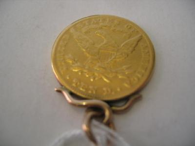 Appraisal: A GOLD USA DOLLAR COIN dated in a soldered pendant