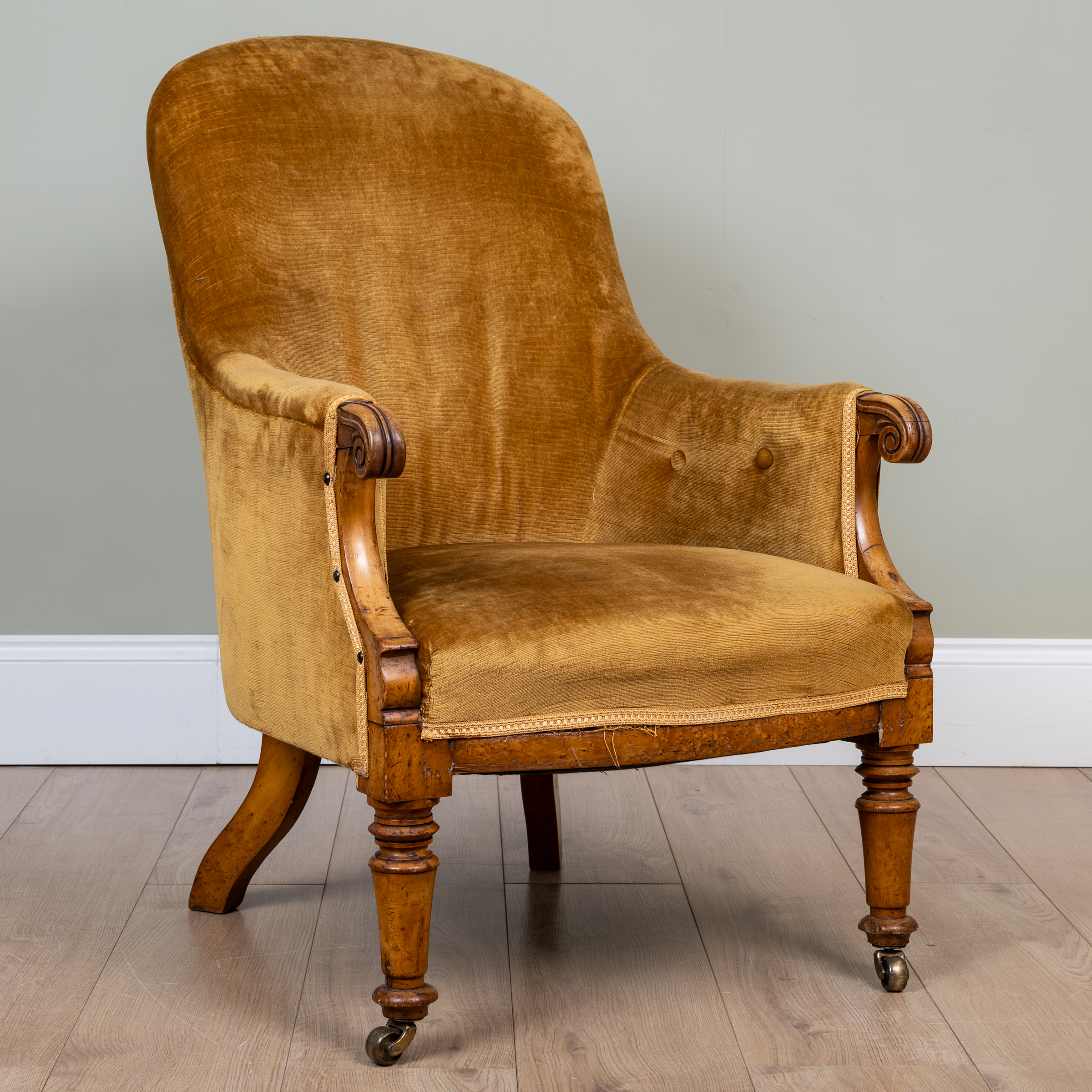 Appraisal: A Victorian satinwood small occasional chair with button upholstered arms