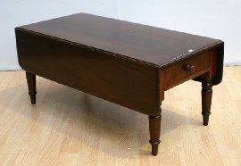 Appraisal: An early Victorian mahogany low pembroke table with truncated legs