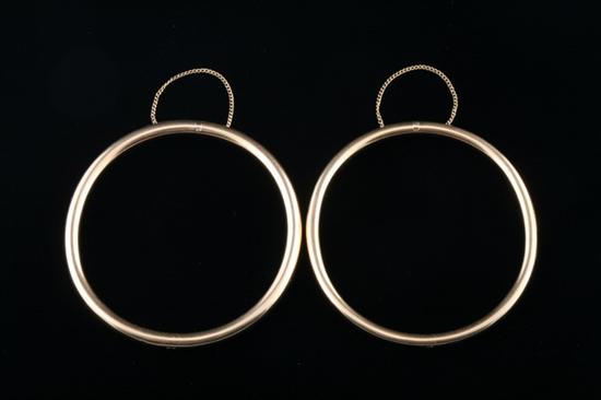 Appraisal: PAIR CONTINENTAL YELLOW GOLD HINGED OVAL TUBULAR BANGLE BRACELETS Early