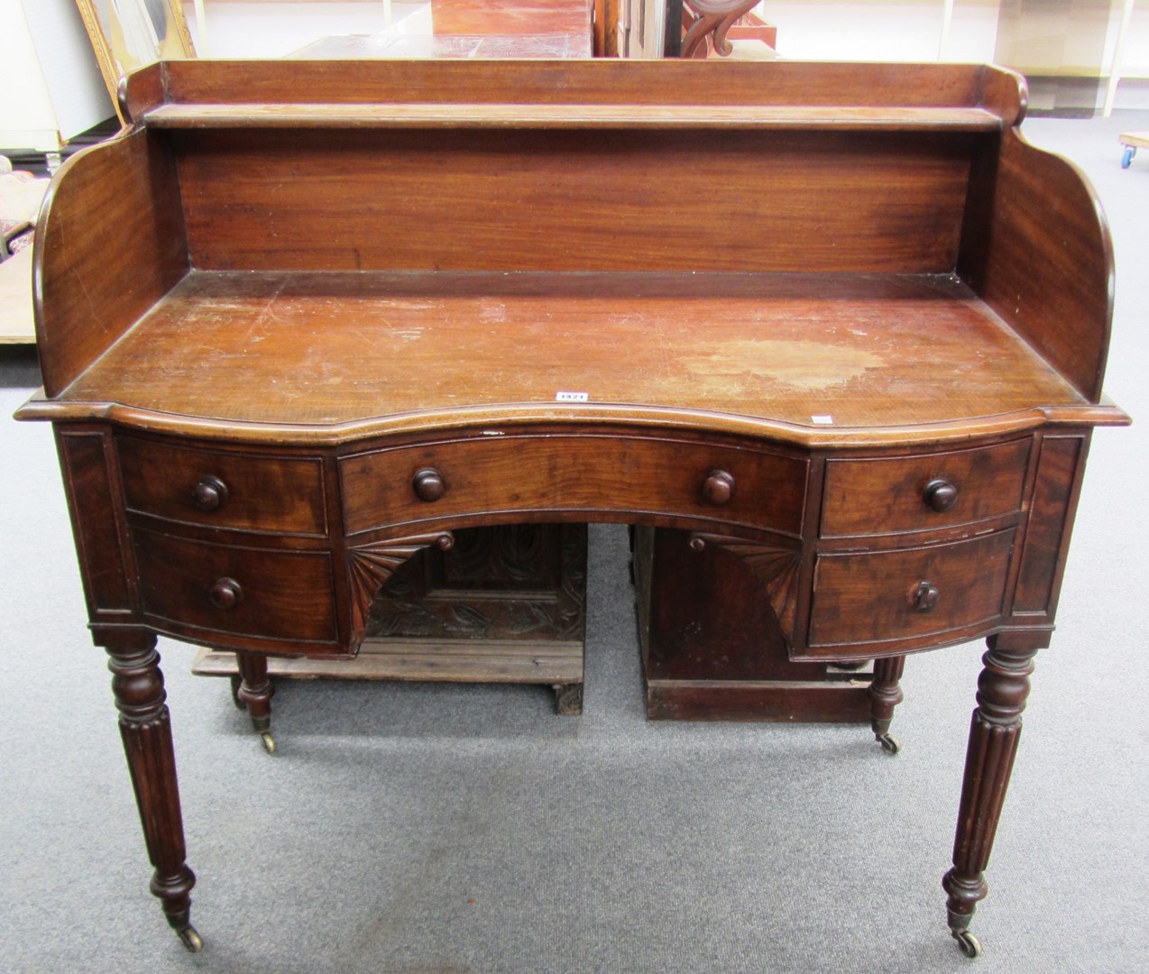 Appraisal: A th century mahogany washstand with galleried back and five