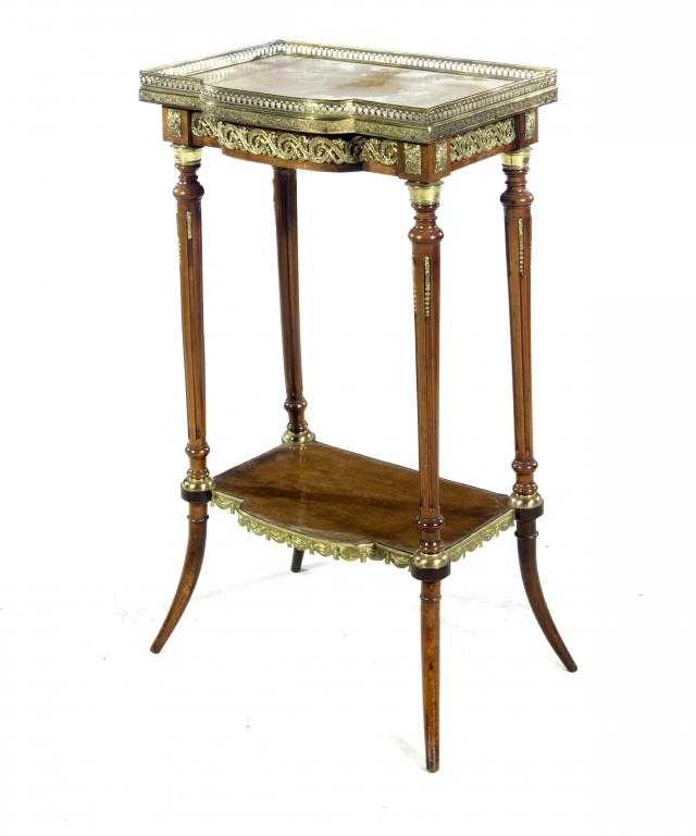 Appraisal: A FRENCH GILT BRASS MOUNTED MAHOGANY GU RIDON with galleried