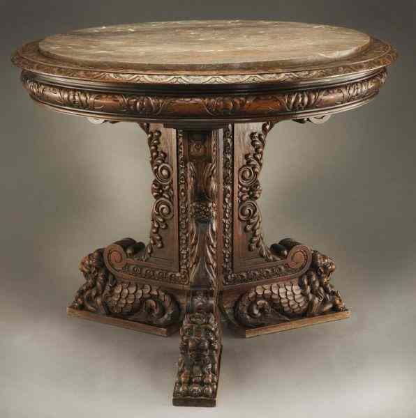 Appraisal: Continental carved walnut marble top tablehaving a round marble top