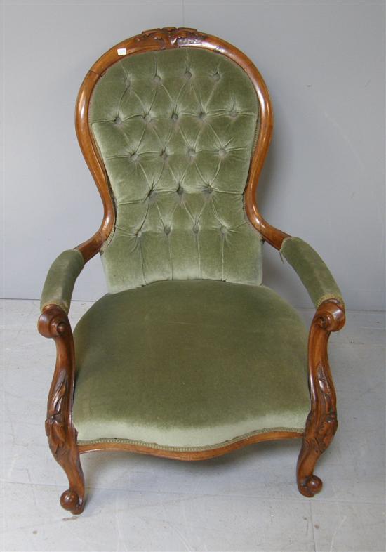 Appraisal: th century mahogany framed upholstered button back armchair on scroll