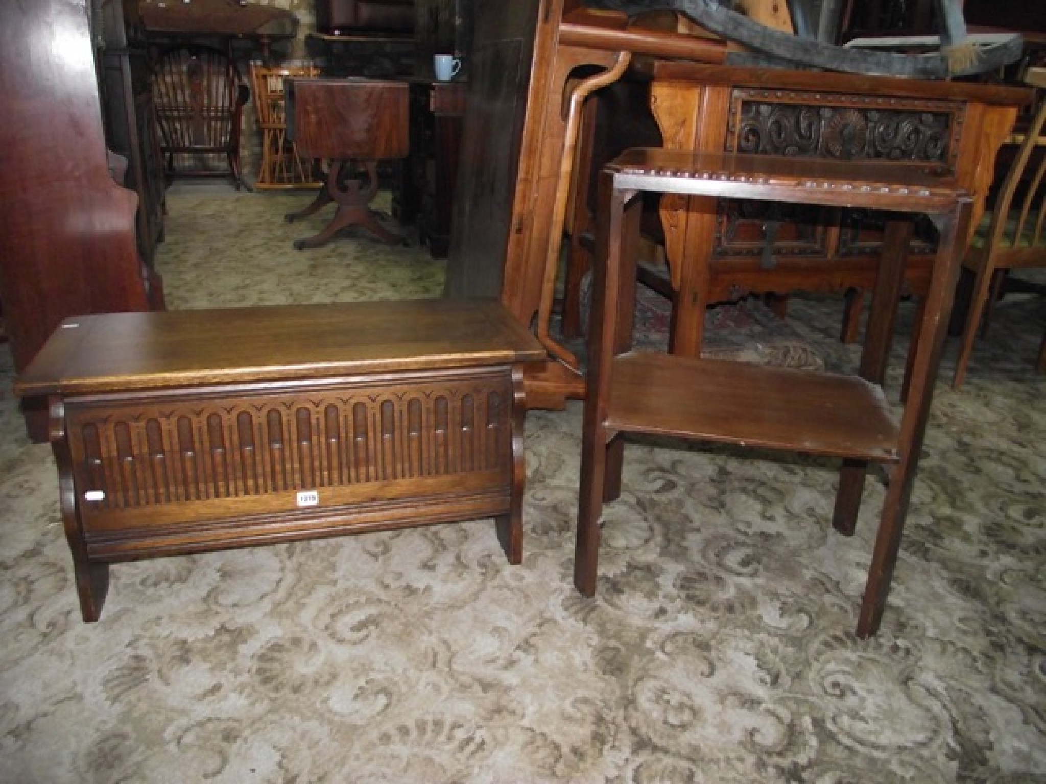 Appraisal: A reproduction oak coffer with hinged lid and shaped supports