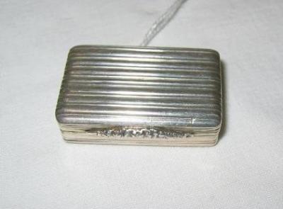 Appraisal: A GEORGIAN VINAIGRETTE of reeded oblong form the hinged rim