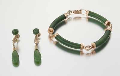 Appraisal: A Carved Jade Bracelet and Earrings Mounted in Gold k