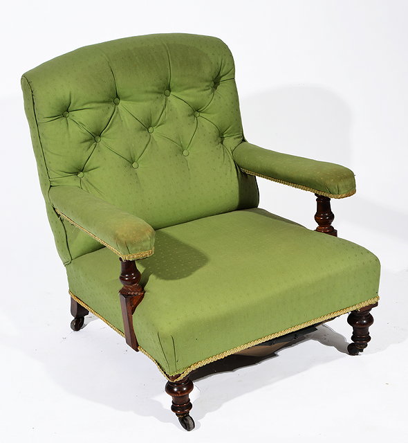 Appraisal: A VICTORIAN HOWARD STYLE LIBRARY OPEN ARM CHAIR with turned