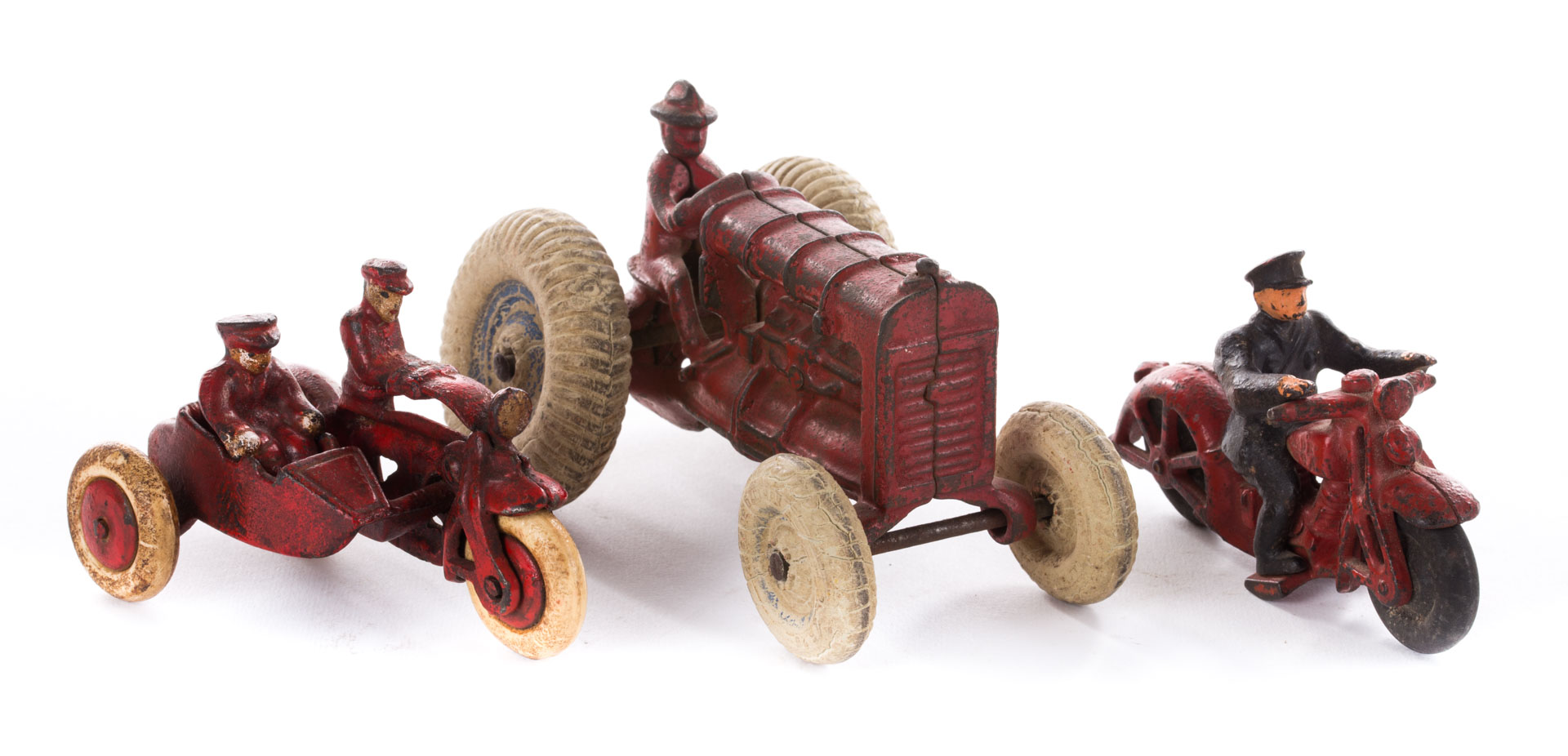 Appraisal: Three cast iron vehicles including Arcade tractor with rubber wheels