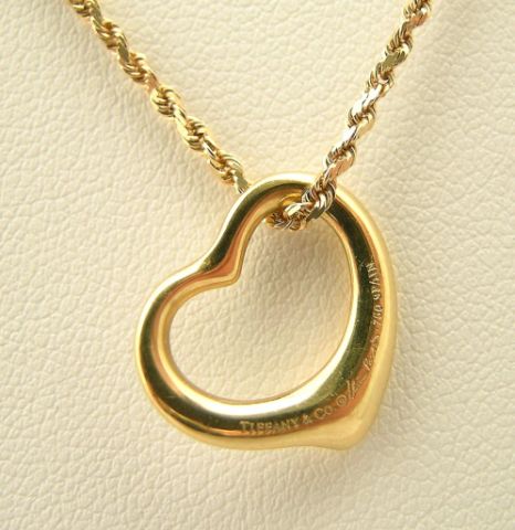 Appraisal: K yellow gold chain with K yellow gold Tiffany heart