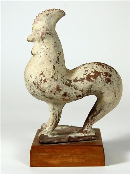 Appraisal: A Chinese Tang style pottery cockerel decorated with a white