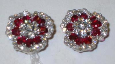 Appraisal: A PAIR OF RUBY AND DIAMOND EAR CLIPS in the