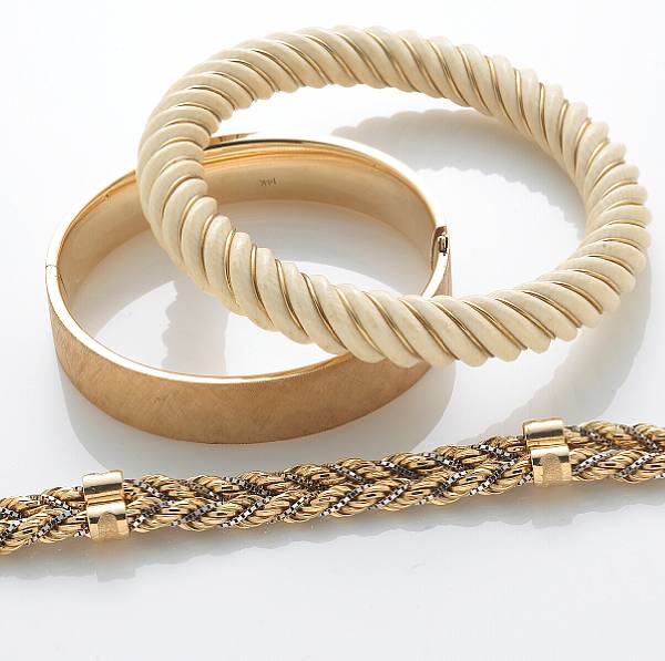 Appraisal: A collection of three k gold bracelets comprising a bi-color