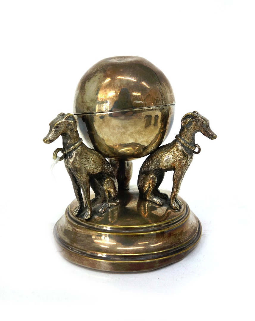 Appraisal: A late Victorian electroplate inkwell of hinged spherical form resting