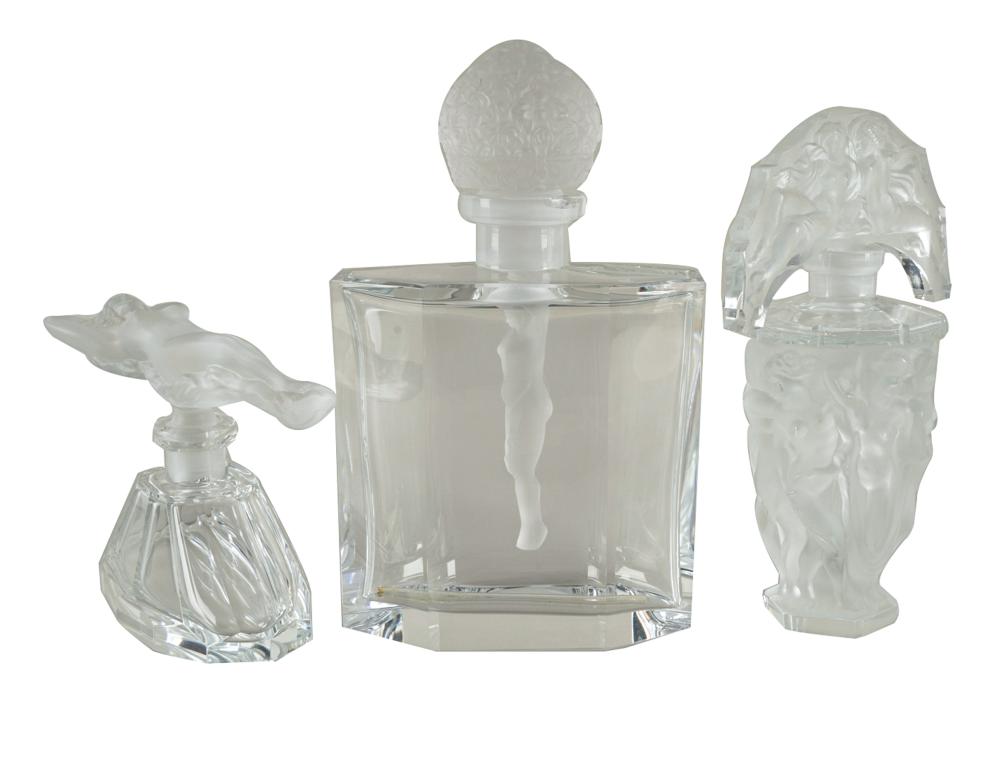 Appraisal: THREE GLASS PERFUME BOTTLESwith figural stoppers comprising two unmarked one