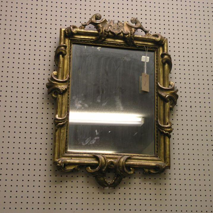 Appraisal: A th century French gilt mirror carved with scrolls in