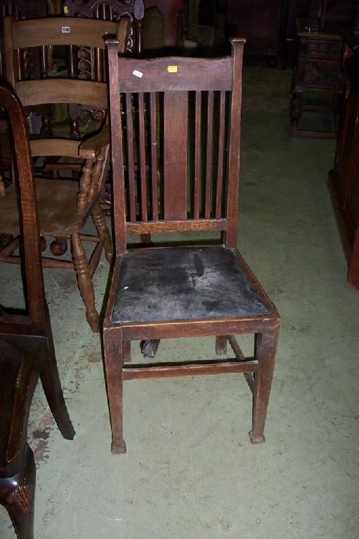 Appraisal: A set of four Arts Crafts oak rail back dining