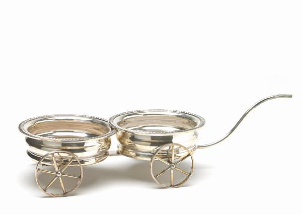 Appraisal: A plated two coaster decanter wagon after the antique Pair