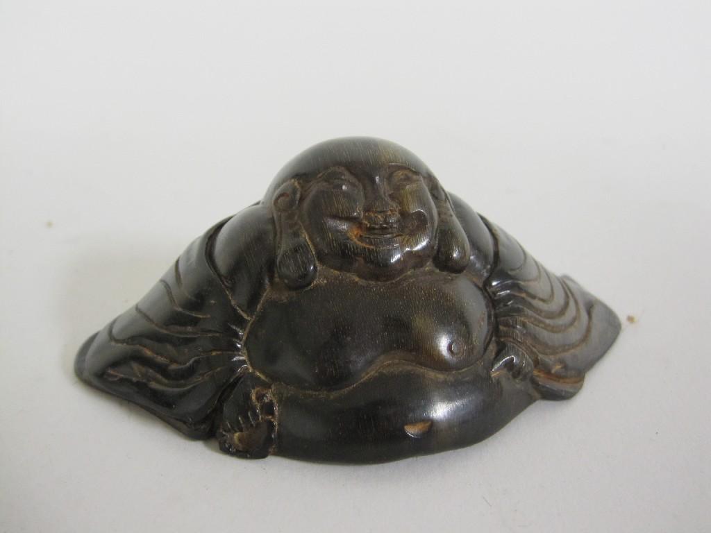 Appraisal: A Chinese carved horn Buddha