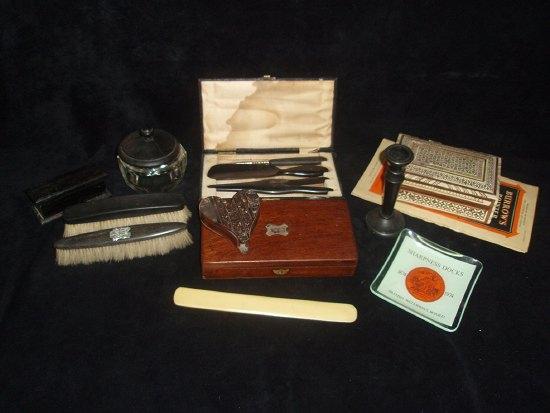 Appraisal: A collection of sundries including ebony dressing table items and