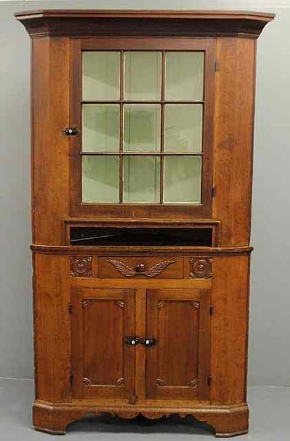 Appraisal: Pennsylvania poplar two-piece corner cupboard th c the upper section