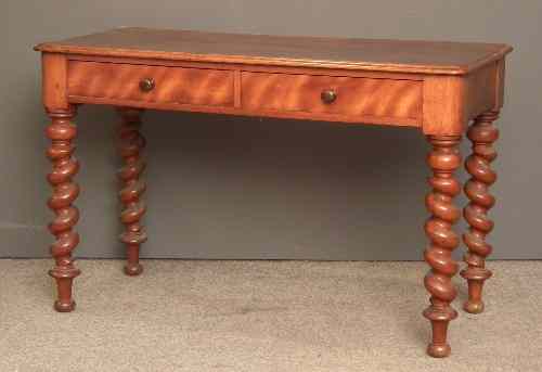 Appraisal: A Victorian mahogany rectangular side table with rounded front corners