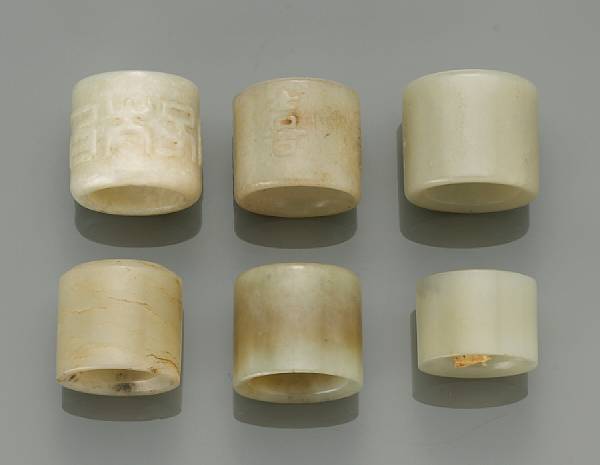 Appraisal: A group of six jade and hardstone archaistic rings Including