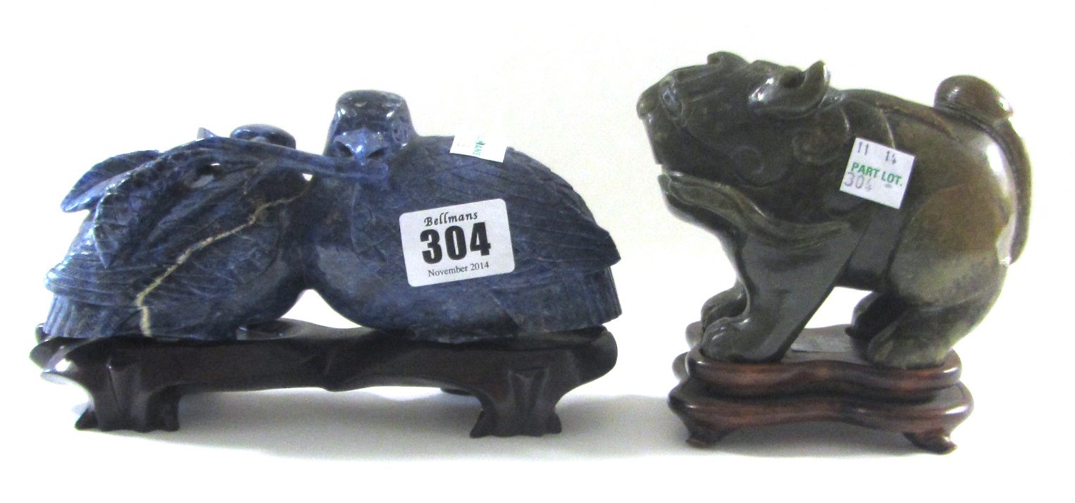 Appraisal: A Chinese mottled jade figure of a standing lion late