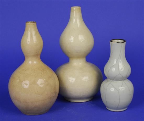 Appraisal: THREE CHINESE GLAZED DOUBLE GOURD FORM VASES the smallest bears