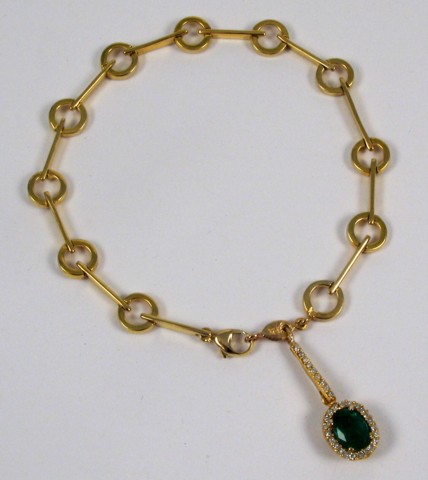 Appraisal: EMERALD AND DIAMOND BRACELET The k gold chain bracelet is