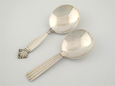 Appraisal: By Georg Jensen Two modern caddy spoons one with a