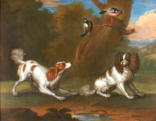 Appraisal: TH CENTURY ENGLISH SCHOOLTwo playful spaniels in a wooded landscape