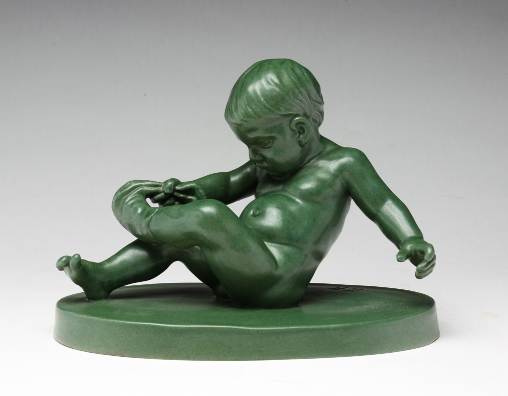 Appraisal: P IPSEN GLAZED SCLUPTURE THE STOCKING BOY Denmark th quarter