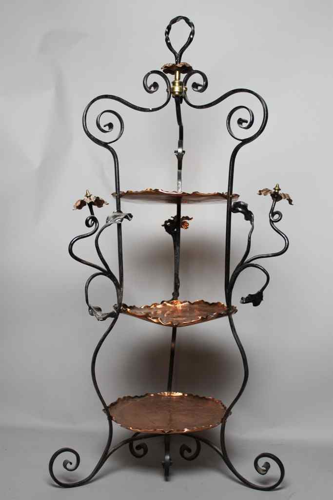 Appraisal: COPPER AND WROUGHT IRON DUMBWAITER With three shaped circular copper