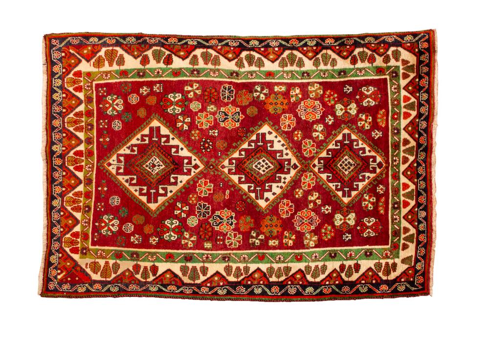 Appraisal: PERSIAN QASHQAI CARPETPersian Qashqai Carpet red ground triple medallion ft