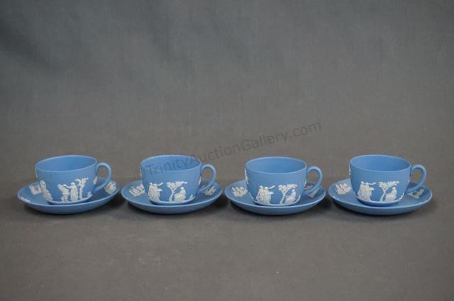 Appraisal: Wedgewood Jasperware Cup and Saucer Sets White on Blue Jasperware