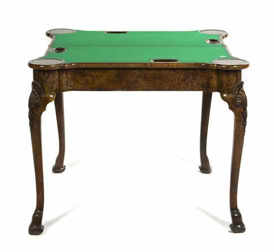 Appraisal: A Continental Burr Walnut Games Table having a shaped rectangular