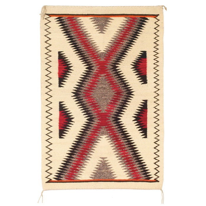 Appraisal: Navajo rug c zig-zag pattern in red brown and orange