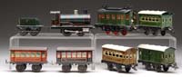 Appraisal: TWO O GAUGE BING LITHOGRAPH PASSENGER SETS Fairly early steam