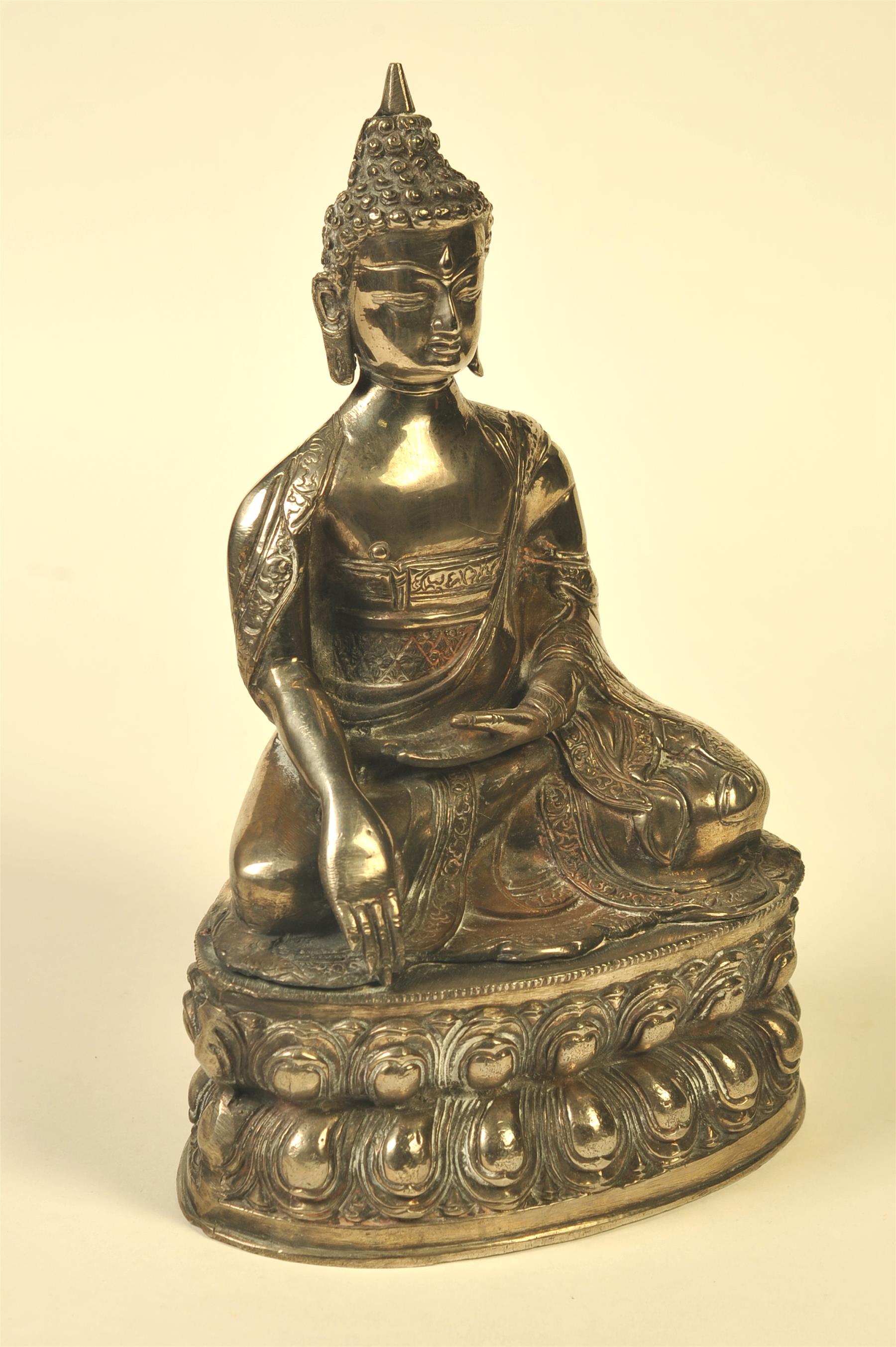 Appraisal: BRONZE BUDDHA WITH SILVER WASH Asian th century Seated on